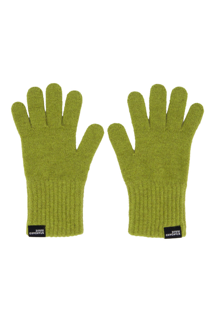 Pair of green gloves with brand labels on a white background