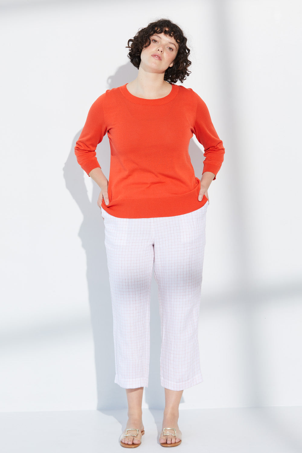 A woman wearing a white Standard Issue Grid Linen Relaxed Pant.