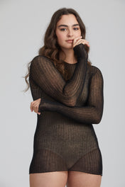 A woman standing wearing a black Standard Issue Cotton Tulle Top.